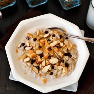 Pressure Cooker (Instant Pot) Almond Joy Steel Cut Oats in a white bowl with a spoon