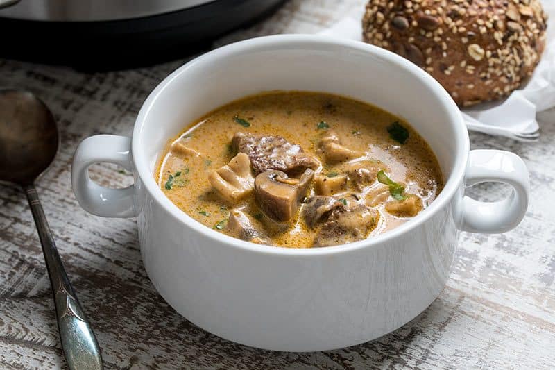 a white bowl with Beef and Mushroom Stew