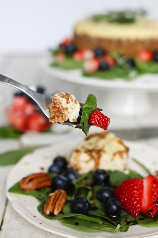 Pressure Cooker Savory Blue Cheese Cheesecake with a strawberry spinach salad and drizzled with a sweet balsamic vinaigrette.