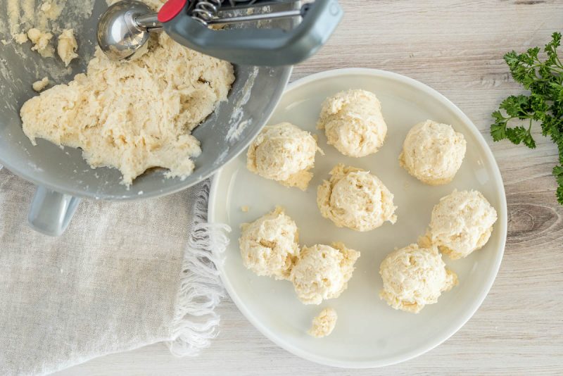 Preparing the homemade dough for Instant Pot chicken and dumplings and scooping them into balls.