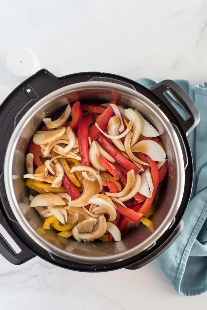 An overhead shot of all of the ingredients for Chicken Fajitas in the pressure cooker