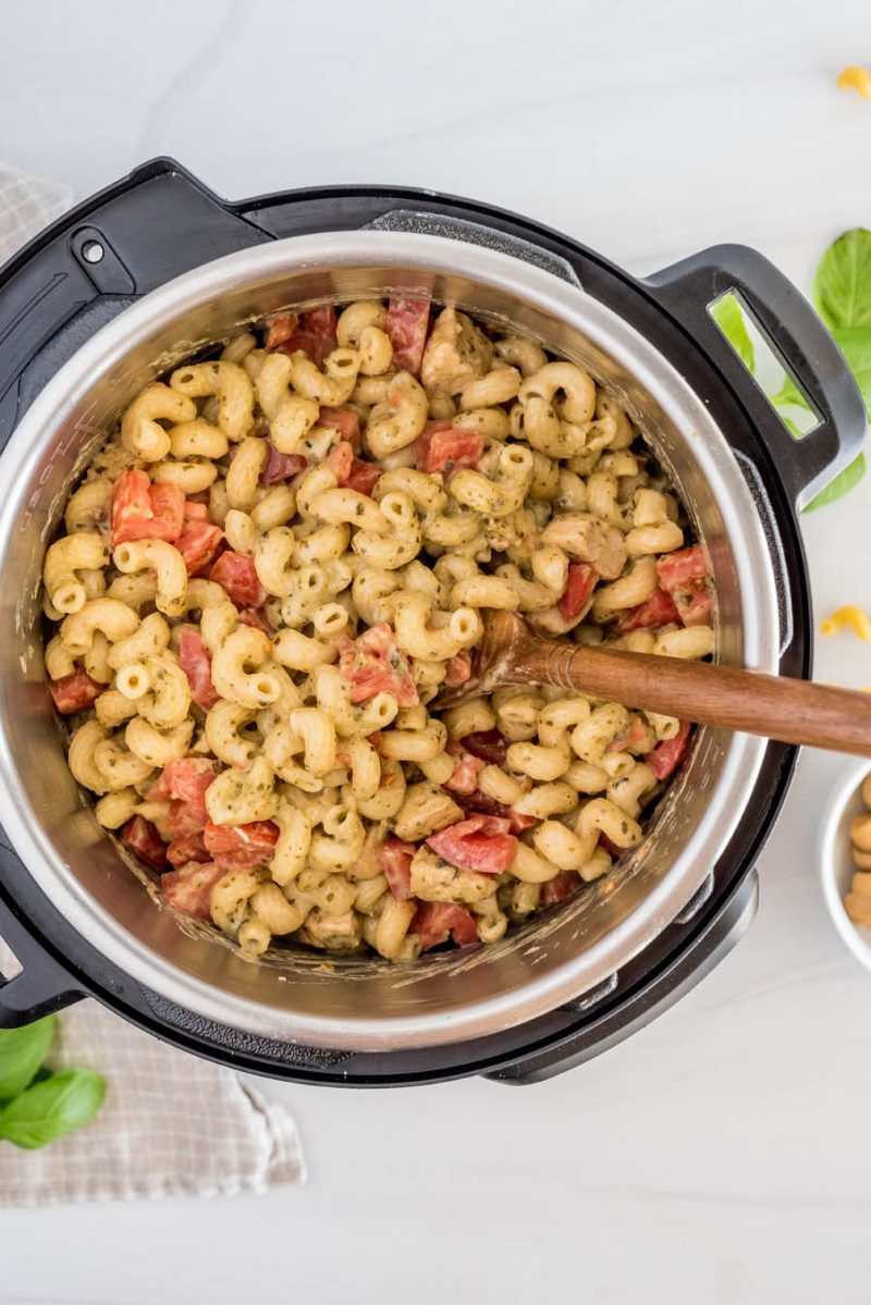 Overhead view of chicken pesto pasta cooked and ready to serve in an Instant Pot.