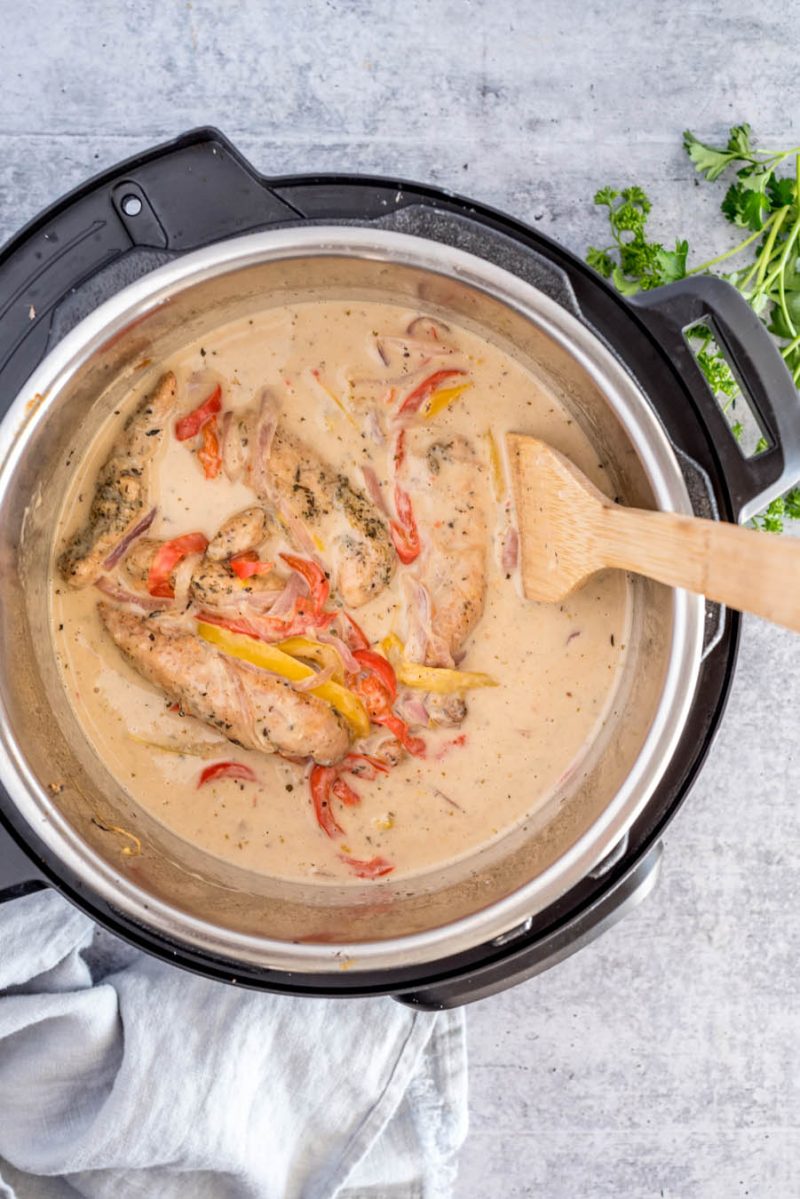 an overhead shot of the chicken scampi inside an Instant Pot, prepared and ready to serve with pasta