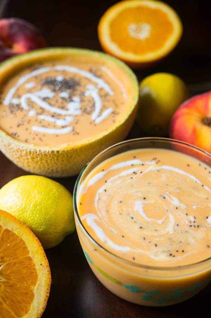 Pressure Cooker Chilled Fruit Soup - one serving in a clear bowl and another serving in half of a hollowed out cantaloupe