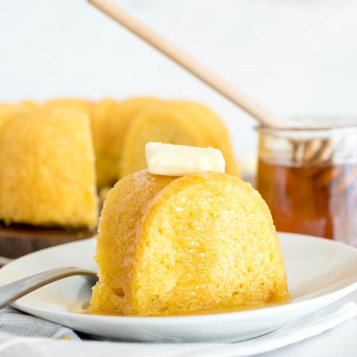 slice of jiffy cornbread with maple syrup and butter