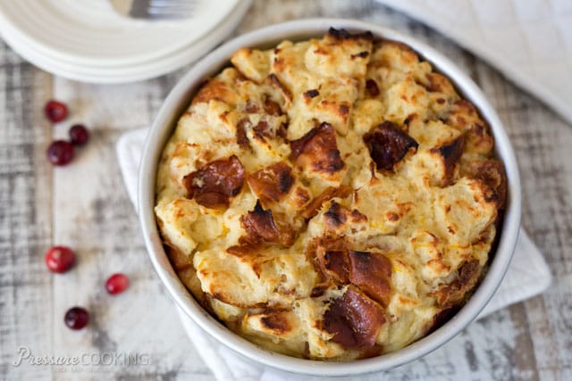 This luscious Pressure Cooker Cranberry Baked French Toast is a perfect holiday breakfast. Tart fresh cranberries in a sweet orange sauce are topped with cubed Challah bread soaked in butter, milk, and eggs, and then \"baked\" to create a bread pudding style French Toast.