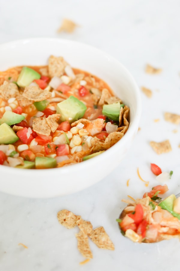 white soup bowl filled with Creamy Enchilada Soup with chicken