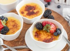 three ramekins of creme brulee with sugar crust