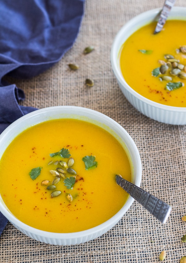 2 white bowls filled with Pressure Cooker Curried Carrot Soup