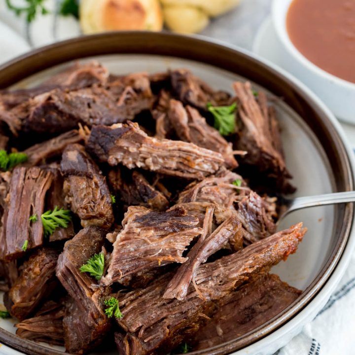 bowl of pot roast from an instant pot with parsley on top