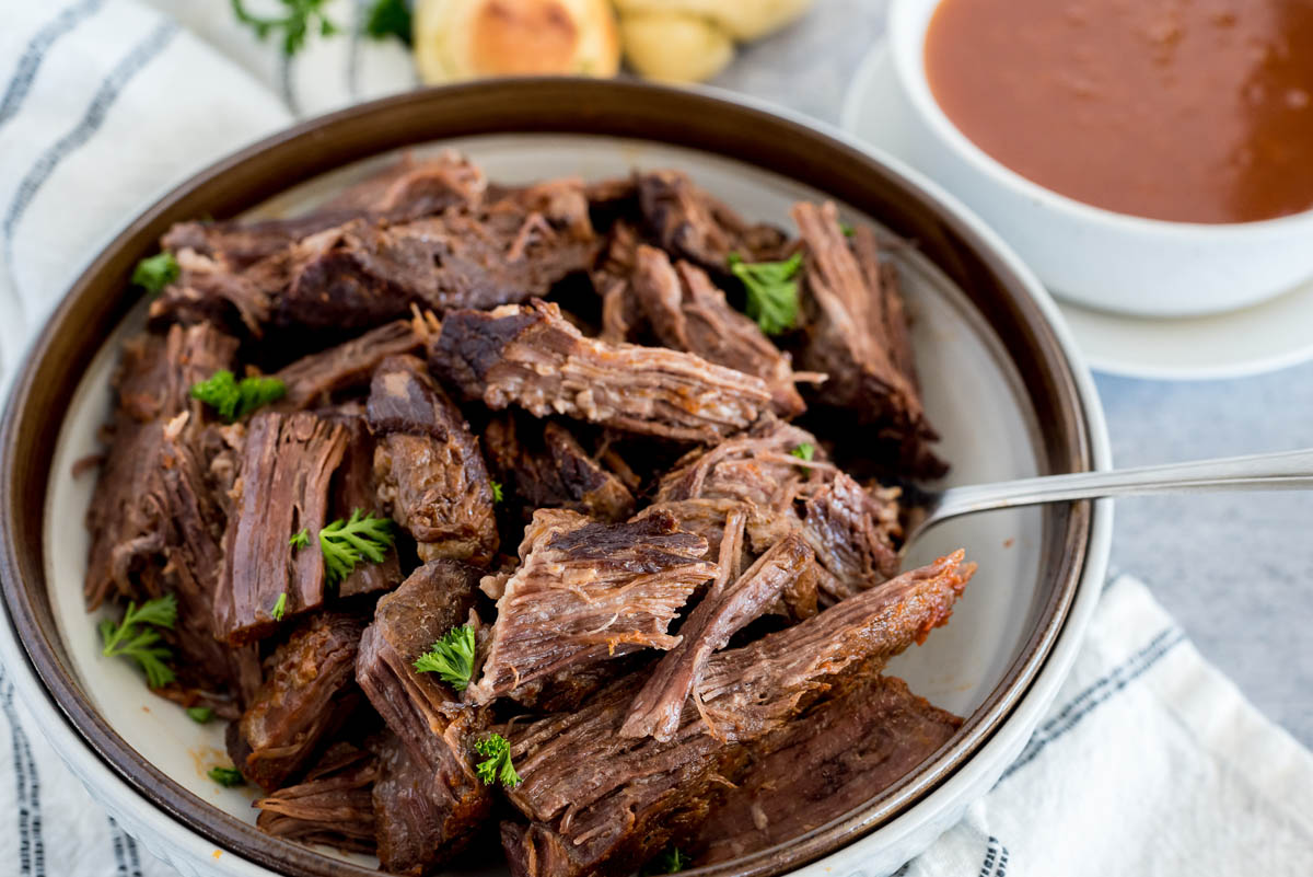 bowl of pot roast from an instant pot with parsley on top