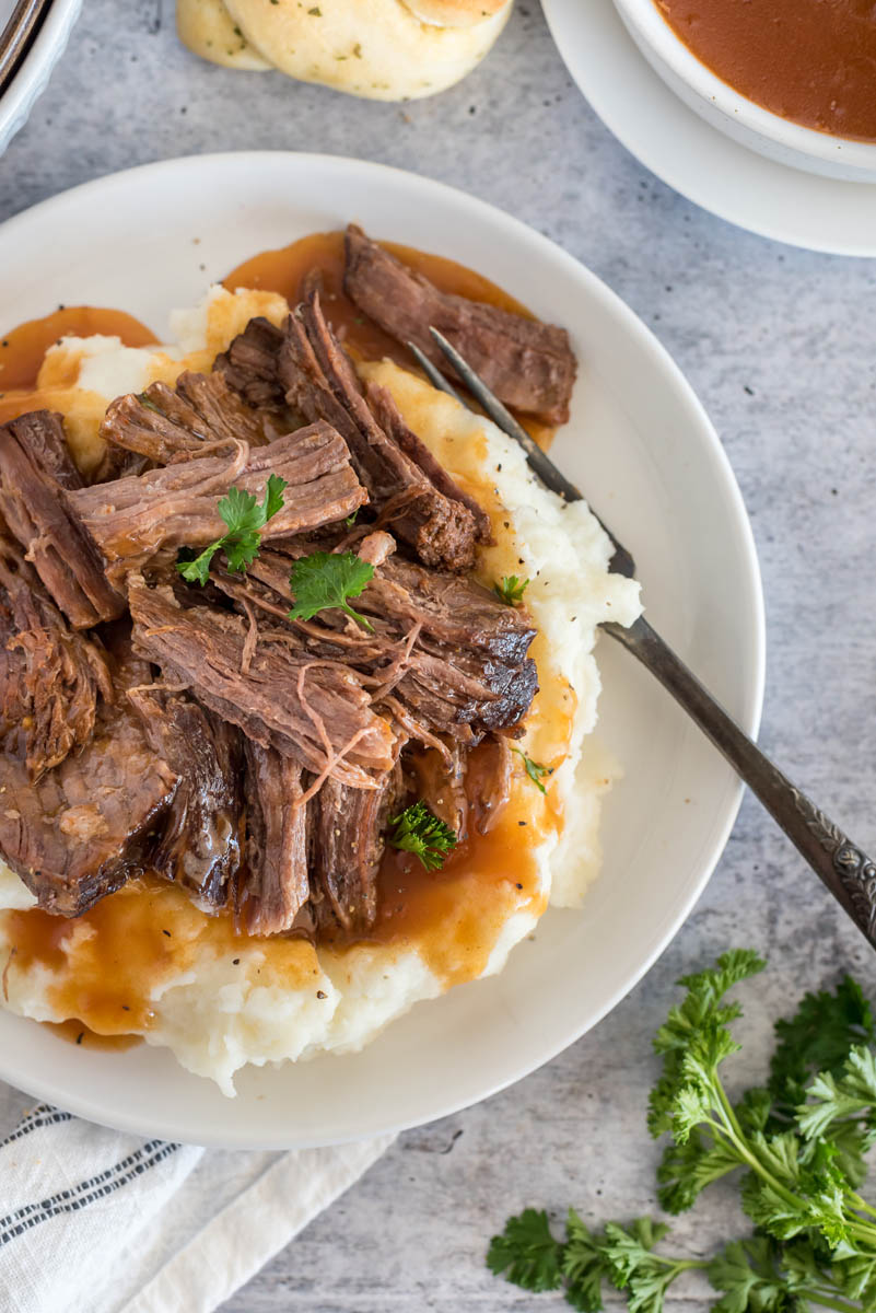 overhead of instant pot beef with mashed potatoes