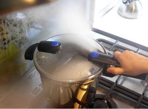 steam release from a standard pressure cooker on the stove