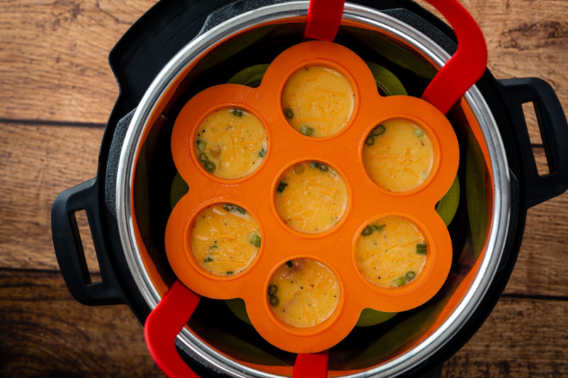 Stacked silicone trays in the Instant Pot for making Pressure Cooker Egg Bites