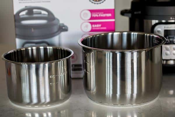 Cooking pot of the Mini side by side with the Instant Pot Duo cooking pot.