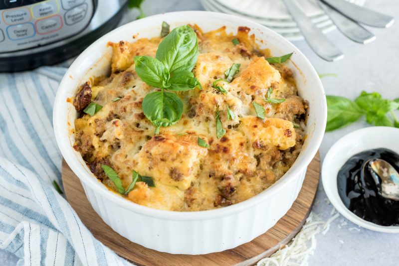 white baking dish of pressure cooked breakfast casserole with basil