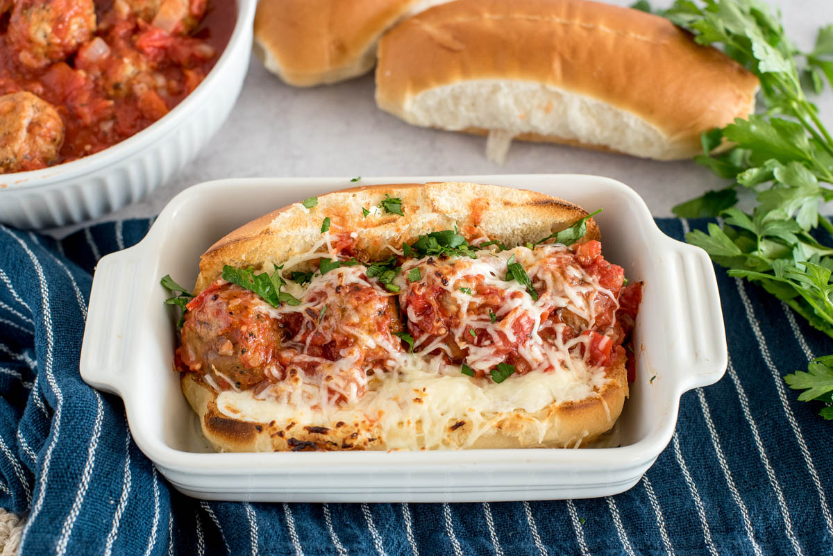 meatball sub made in a pressure cooker in a white baking dish