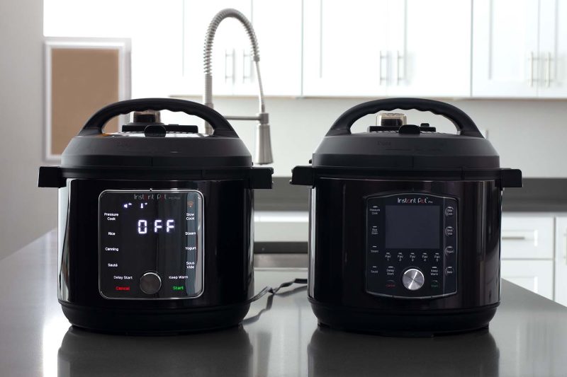 Instant Pot Pro Plus on a kitchen counter next to the Instant Pot Pro for comparison.