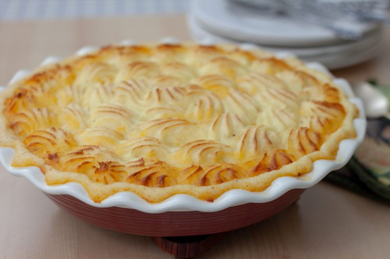 Instant Pot shepherds pie topped with mashed potatoes and browned in the oven.