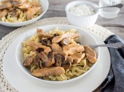 Instant Pot / Pressure Cooker Pork Stroganoff, dished up over egg noodles