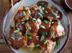 Pressure Cooker (Instant Pot) Korean Chicken Thighs on a serving platter, garnished with fresh scallions