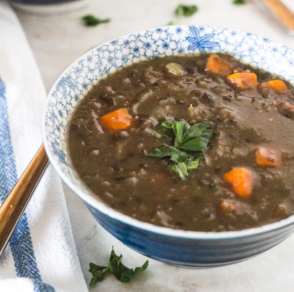 blue and white soup bowl with Pressure Cooker Hearty Lentil Beer Soup