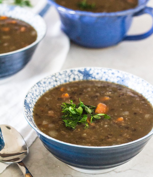 Pressure Cooker (Instant Pot) Hearty Lentil Beer Soup served in blue bowls