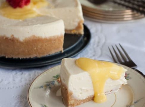 slice of Pressure Cooker ((Instant Pot) Meyer Lemon Cheesecake on a white plate