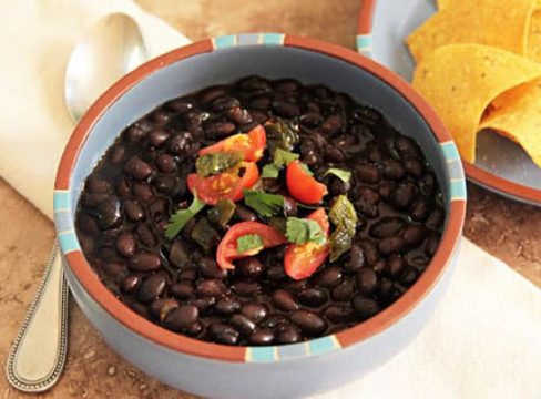 Pressure Cooker (Instant Pot) Black Beans in a white and orange bowl
