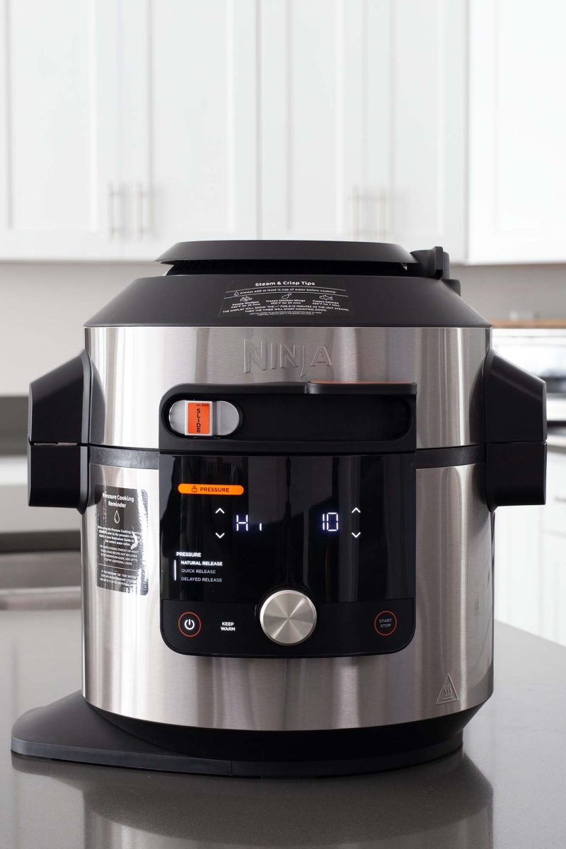 Ninja Foodi Smart XL with LCD display on in pressure cooking mode.