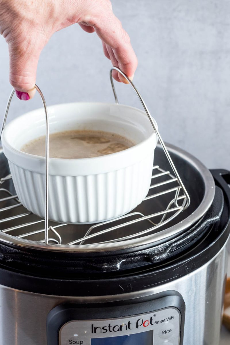 Removing the trivet with oatmeal for one from an Instant Pot.