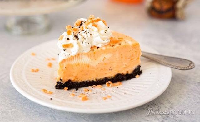 Pressure Cooker (Instant Pot) Orange Marble Cheesecake served on a white dessert plate