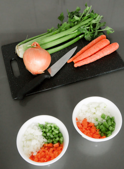 Dice enough veggies for two different meals and refrigerate one for later