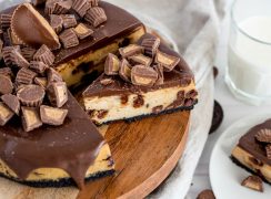 overhead of peanut butter cheesecake with reeses cups on top