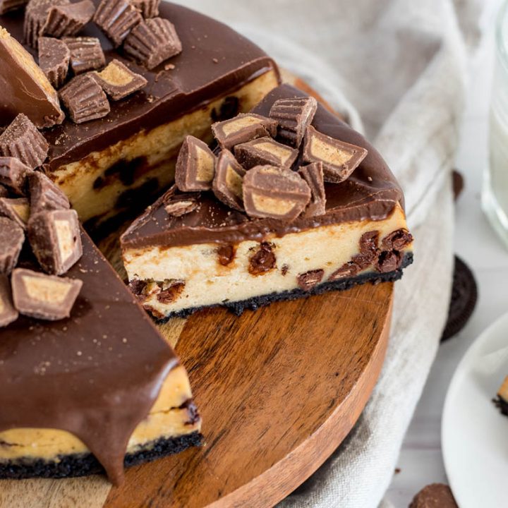 overhead of peanut butter cheesecake with reeses cups on top