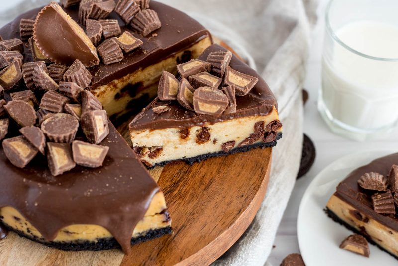 overhead of peanut butter cheesecake with reeses cups on top