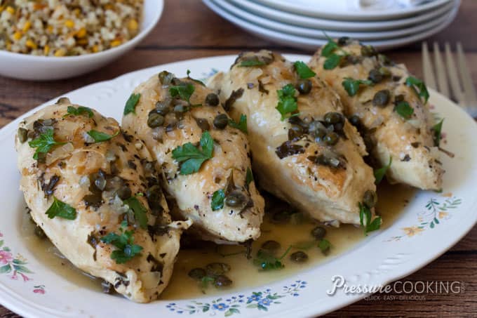 Pressure Cooker (Instant Pot) Braised Chicken with Capers and Parsley on a white serving platter