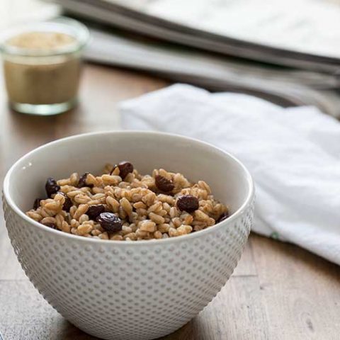 Pressure Cooker (Instant Pot) Brown Sugar Raisin Breakfast Farro served in a white bowl