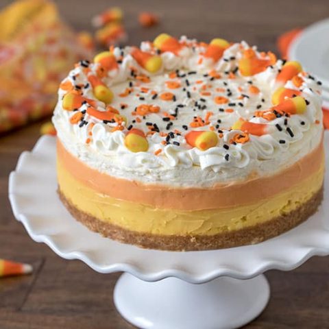 Pressure Cooker (Instant Pot) Candy Corn Cheesecake on a cake stand