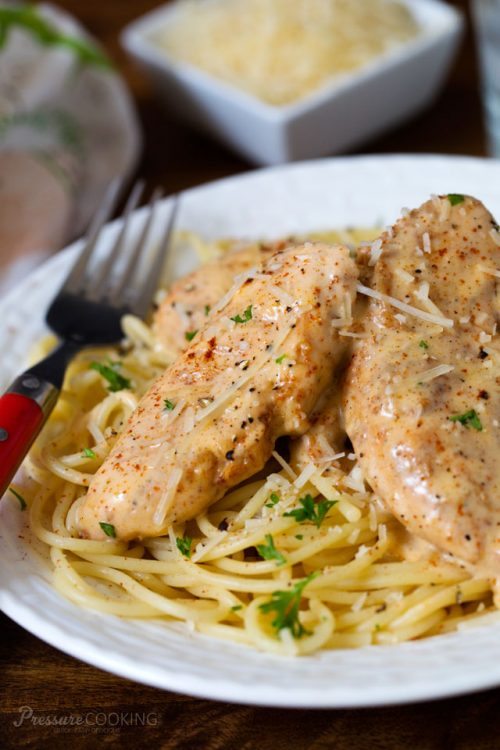 Pressure Cooker Chicken Lazone on a white plate with a fork