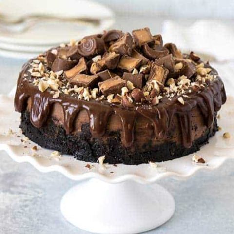 Pressure Cooker (Instant Pot) Nutella Rolo Cheesecake on a cake stand