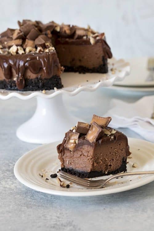 Pressure Cooker Nutella Rolo Cheesecake served on a white plate with a fork