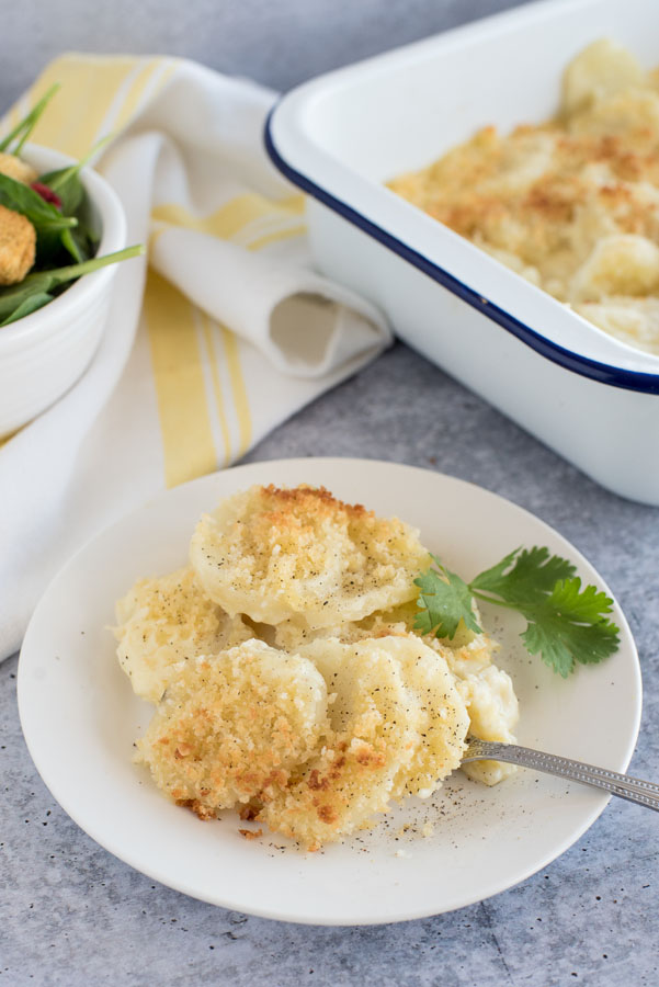 Instant Pot cheesy au gratin potatoes plated up and ready to eat.