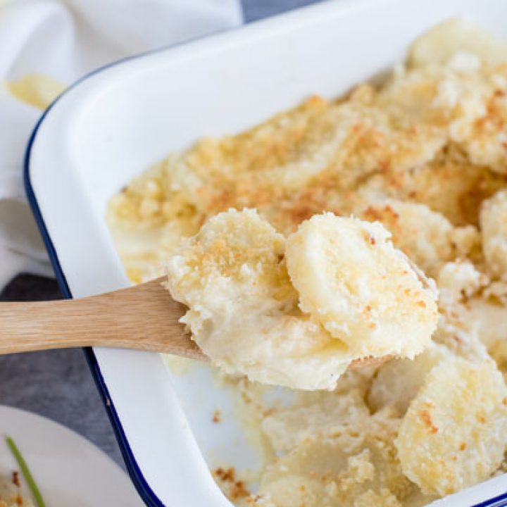 Homemade scalloped potatoes in a serving dish ready to serve.