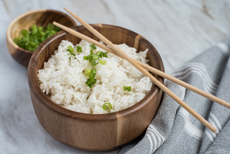 Instant Pot / Pressure Cooker White Rice prepared, garnished with green onions and chopsticks