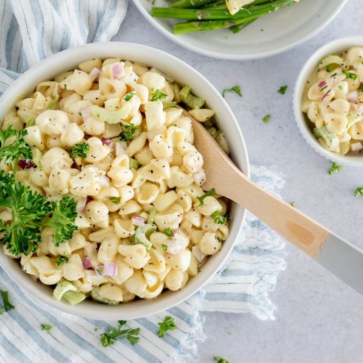 amish macaroni salad with fresh herbs on top