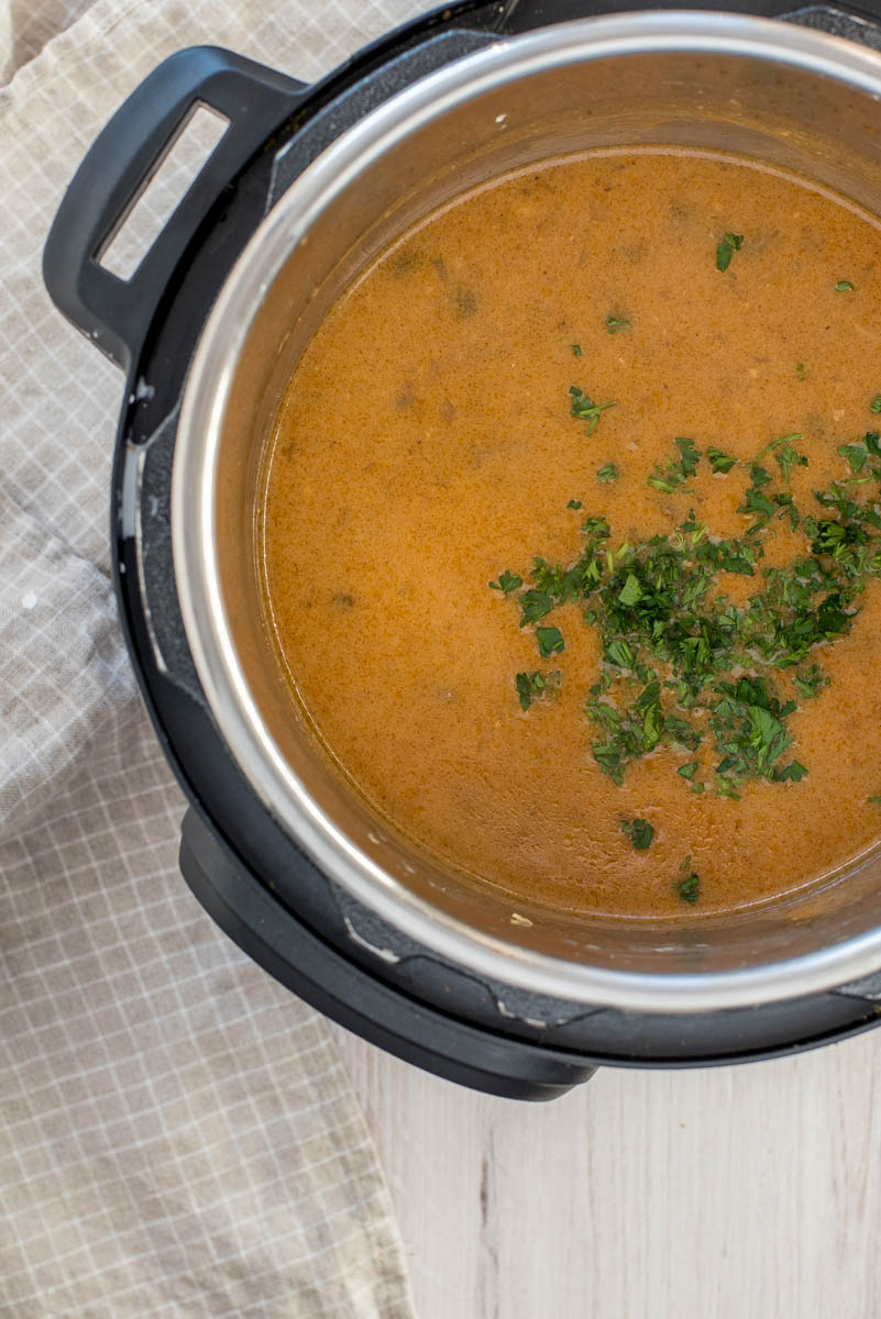 overhead of mushroom sauce for chicken in a pressure cooker