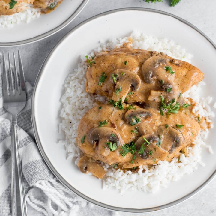 overhead of a white plate with mushrooms sauce