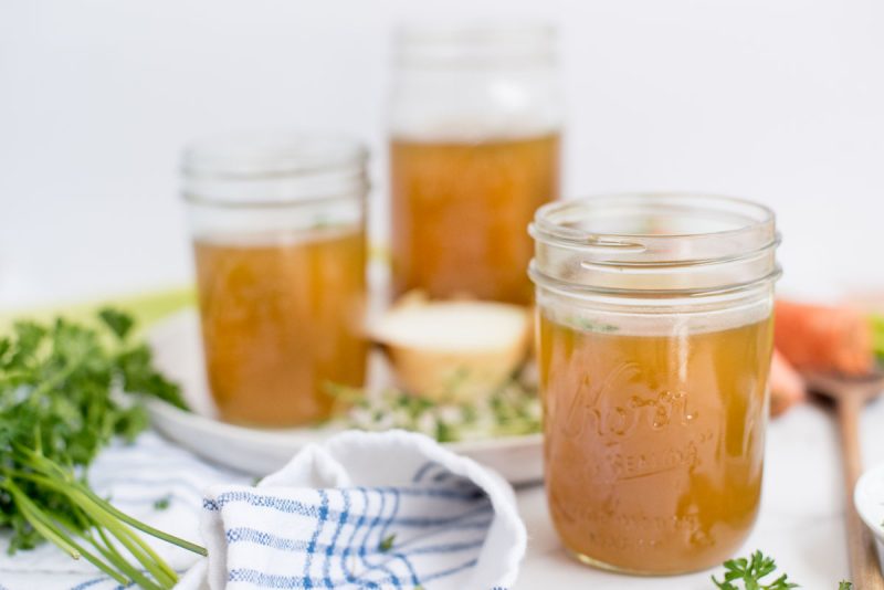 three mason jars with instant pot chicken stock