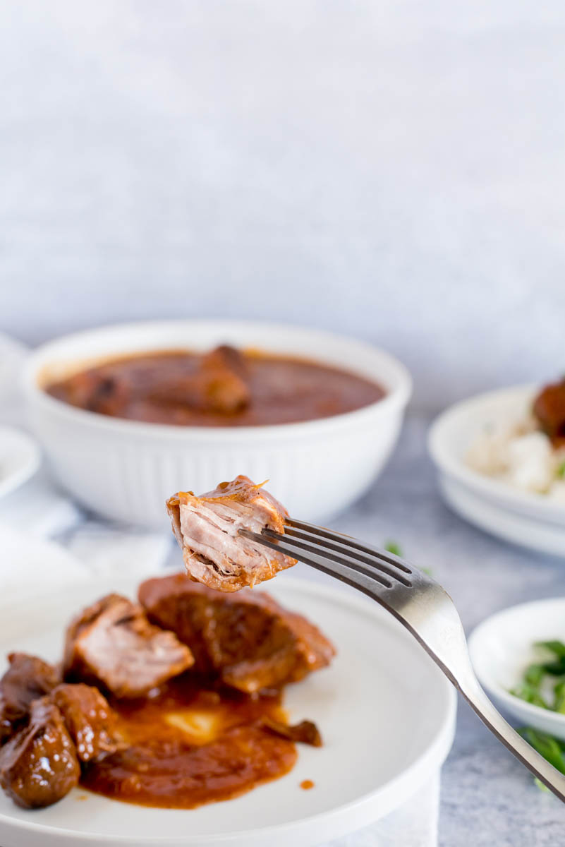 fork holding a boneless pork rib